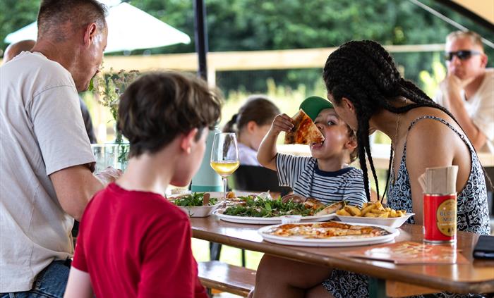 People enjoying sourdough pizza at Silver Circle Distillery